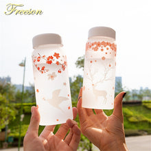 Load image into Gallery viewer, Sakura Swallow Frost Glass Water Bottle with Sleeve 430ml Elk Bottles Creative Camping Sport Bottle Tour Drinkware Dropshipping
